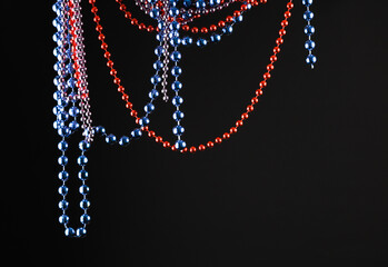 Christmas garlands hanging on a black background