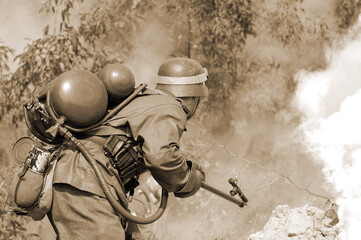  Person in German WW2 military uniform with flame-thrower. Historical military reenacting in Kiev
