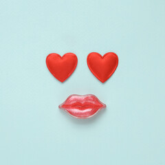 Lips with hearts on a blue background. Beauty concept. Creative idea