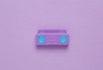 Fototapeta premium Doll boombox recorder on a purple background. Music concept