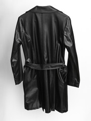 Leather black raincoat isolated on white background. Back view