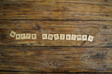 Merry Christmas.  wooden letters merry christmas word  on old wooden background
