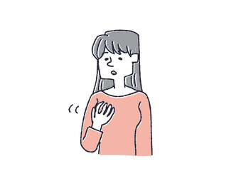 乳房にしこりがないか触って調べている女性