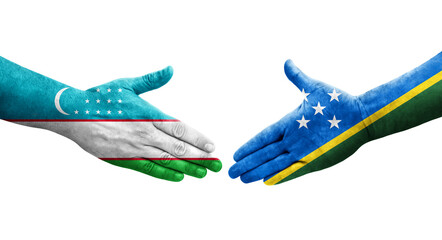 Handshake between Solomon Islands and Uzbekistan flags painted on hands, isolated transparent image.