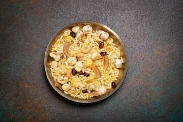 Healthy evening snack for weight loss, made with roasted chiwda, puff rice, cashew nuts, peanuts, makhana and dry coconut flakes