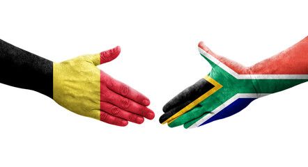 Handshake between South Africa and Belgium flags painted on hands, isolated transparent image.
