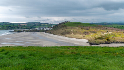 Picturesque hills, seashore. Cloudy rainy weather. Landscapes along the Wild Atlantic Way. Nature of Northwestern Europe. Beautiful places of Ireland.