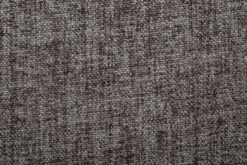Close-up fabric swatches as a background. The texture of the material with patterns of weaving close-up. Upholstery fabric for interior decoration.