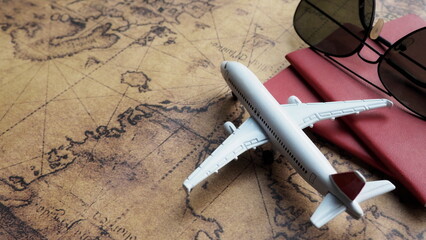 Top view of passport and world map with airplane model , passport with world map travel concept