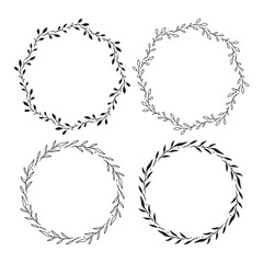 Set of 4 hand drawn spring wreaths isolated on white background, vector. Outline and silhouette frames with leaves. Doodle style.Collection of floral monogram frames.