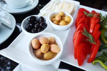 Traditional Turkish Breakfast with black olive and some vegetables like tomatoes