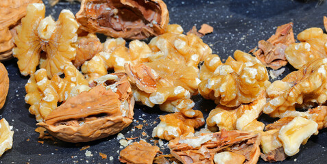 broken shells of walnuts with the edible kernel
