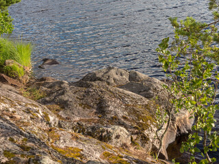 Obraz na płótnie Canvas rocks on the shore of the lake