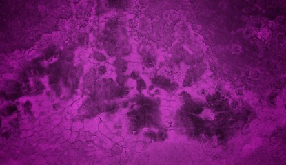 A textured purple concrete wall with a prominent vertical crack. 