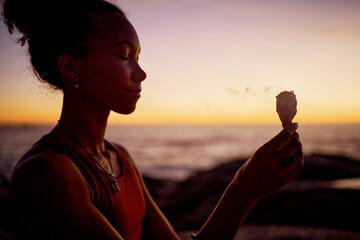 Sunset meditation, woman relax in by beach and ocean for zen peace focus, chakra wellness and...