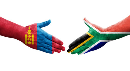Handshake between South Africa and Mongolia flags painted on hands, isolated transparent image.