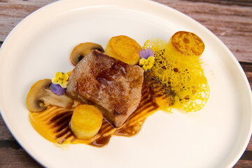 Recipe for veal, potato confit, mushroom, carrot puree, balsamic vinegar sauce, honey and veal stock. High quality photo
