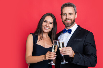 cheers of formal tuxedo couple isolated on white background. couple in formal tuxedo
