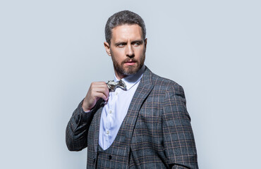 face of guy in tuxedo isolated on grey background. tuxedo guy in studio. photo of guy