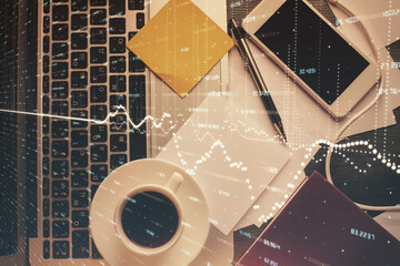 Double exposure of financial chart drawing over table background with computer. Concept of research and analysis. Top view.