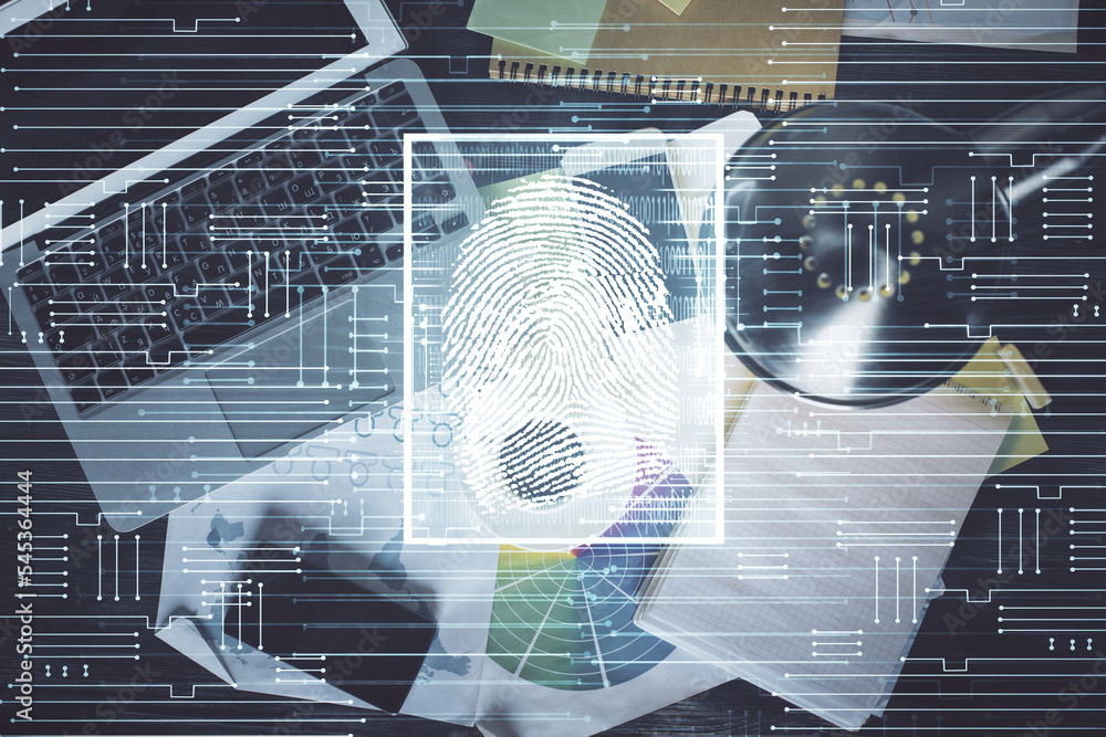 Aufkleber finger print over computer on the desktop background. top view. double exposure. concept of securiti