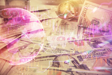 Multi exposure of forex chart drawing over us dollars bill background. Concept of financial success markets.