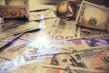 Double exposure of startup drawing over usa dollars bill background. Young business concept.