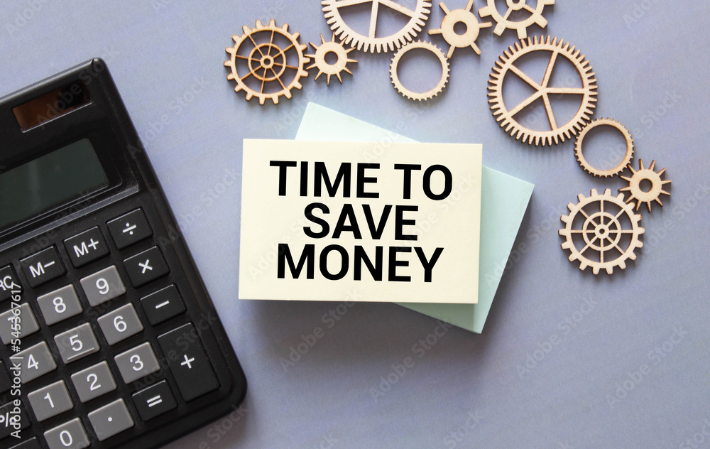 Poster a yellow piece of paper with the text time to save money and the calculator are lying on the notepad