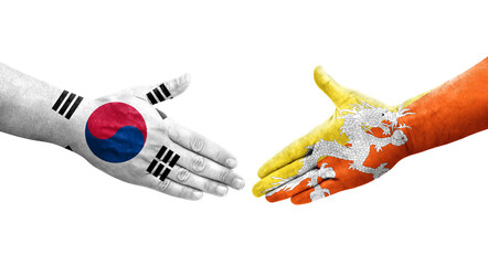 Handshake between South Korea and Bhutan flags painted on hands, isolated transparent image.