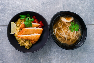 Lunch chicken with rice, tomatoes, cilantro and chicken noodle broth