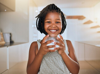 Child, happy and healthy milk drink for energy vitamins or health wellness at home. Black girl...
