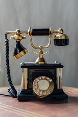 Old antique vintage traditional black phone with disc dials the 19th century
