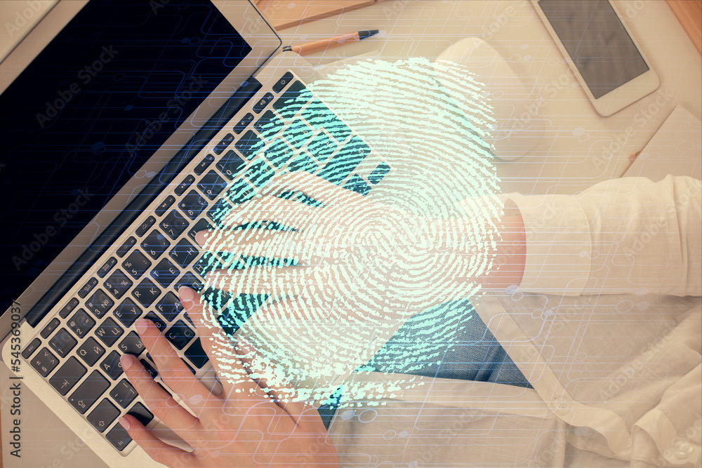 Poster Double exposure of woman hands working on computer and fingerprint hologram drawing. Top View. Digital Security concept.