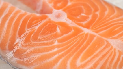 Raw, fresh salmon steak on ice cubes. Buy fish in the market or in the store