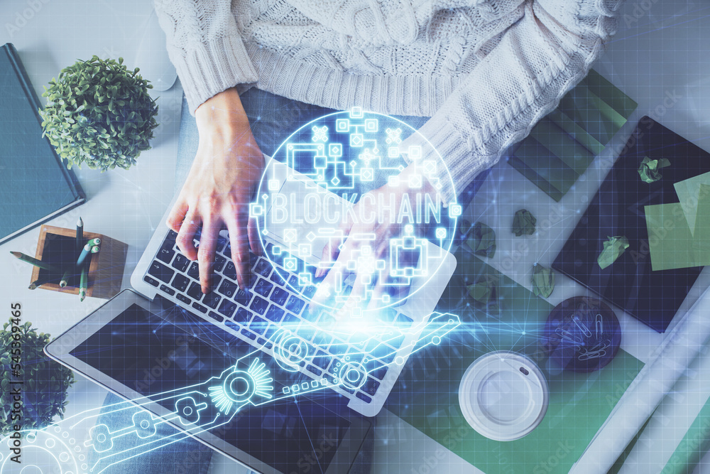 Aufkleber double exposure of woman hands working on computer and blockchain theme hologram drawing. top view. 