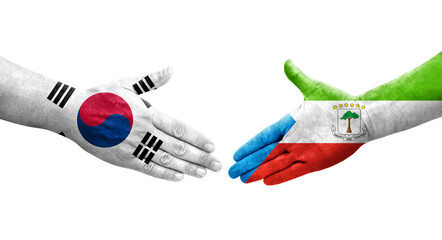 Handshake between South Korea and Equatorial Guinea flags painted on hands, isolated transparent image.