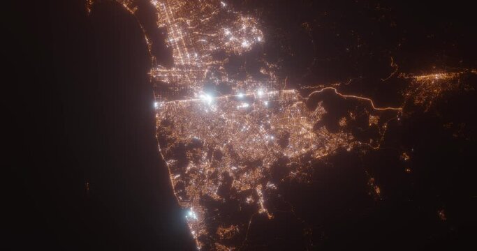 Tijuana (Mexico) aerial view at night. Top view on modern city with street lights. Camera is flying above the city, moving backward