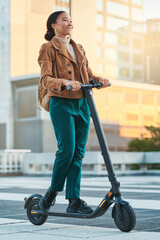 Electrical scooter, woman and city travel on eco friendly transportation, sustainability and clean...