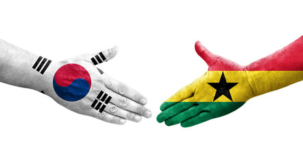 Handshake between South Korea and Ghana flags painted on hands, isolated transparent image.