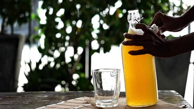 Fermented tea in a glass and bottle, Concept. Kombucha Healthy fermented tea.