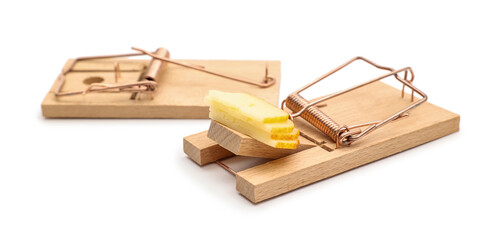 Wooden mousetraps with cheese on white background