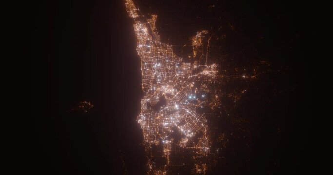 Perth (Australia) aerial view at night. Top view on modern city with street lights. Camera is flying above the city, moving backward