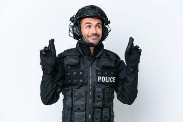 Young caucasian SWAT man isolated on white background with fingers crossing