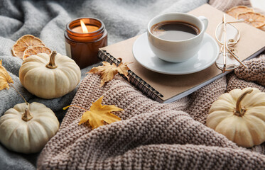 White pumpkins, coffee and autumn leaves
