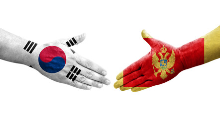 Handshake between South Korea and Montenegro flags painted on hands, isolated transparent image.