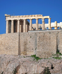 Parthenon ancient greek temple on acropolis of Athens under vibrant blue sky, space for text