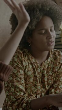 young girl with affro hair  playing tambourine 