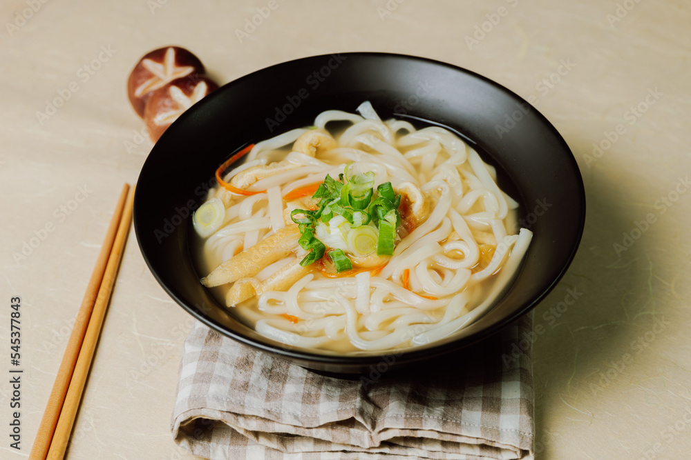 Wall mural Kalguksu, Korean style noodle soup :Fresh knife-cut noodles, made by rolling flour dough and slicing into thin noodles, cooked in anchovy sauce. Zucchini, potatoes, and seafood may beadded.