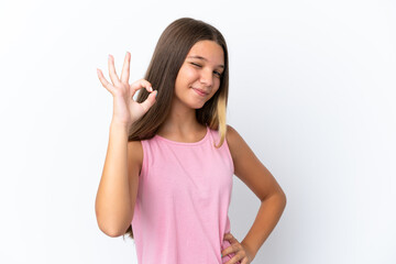 Little caucasian girl isolated on white background showing ok sign with fingers