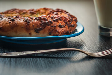 Delicious homemade bread, pastries on a wooden background.